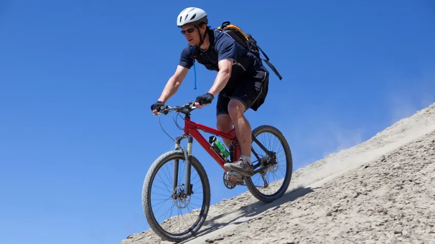 Mountain biker riding a dirt trail in western Colorado desert country